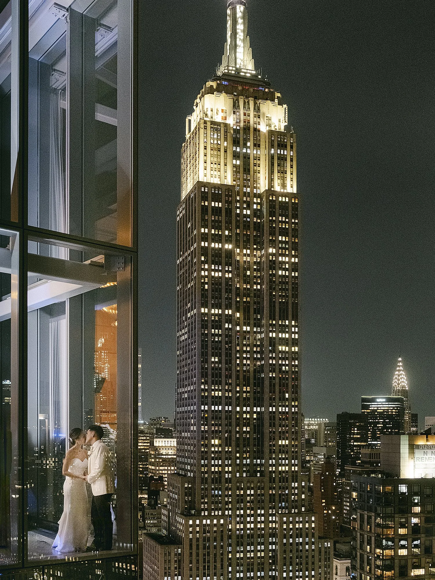 Bride and groom overlooking the Manhattan skyline