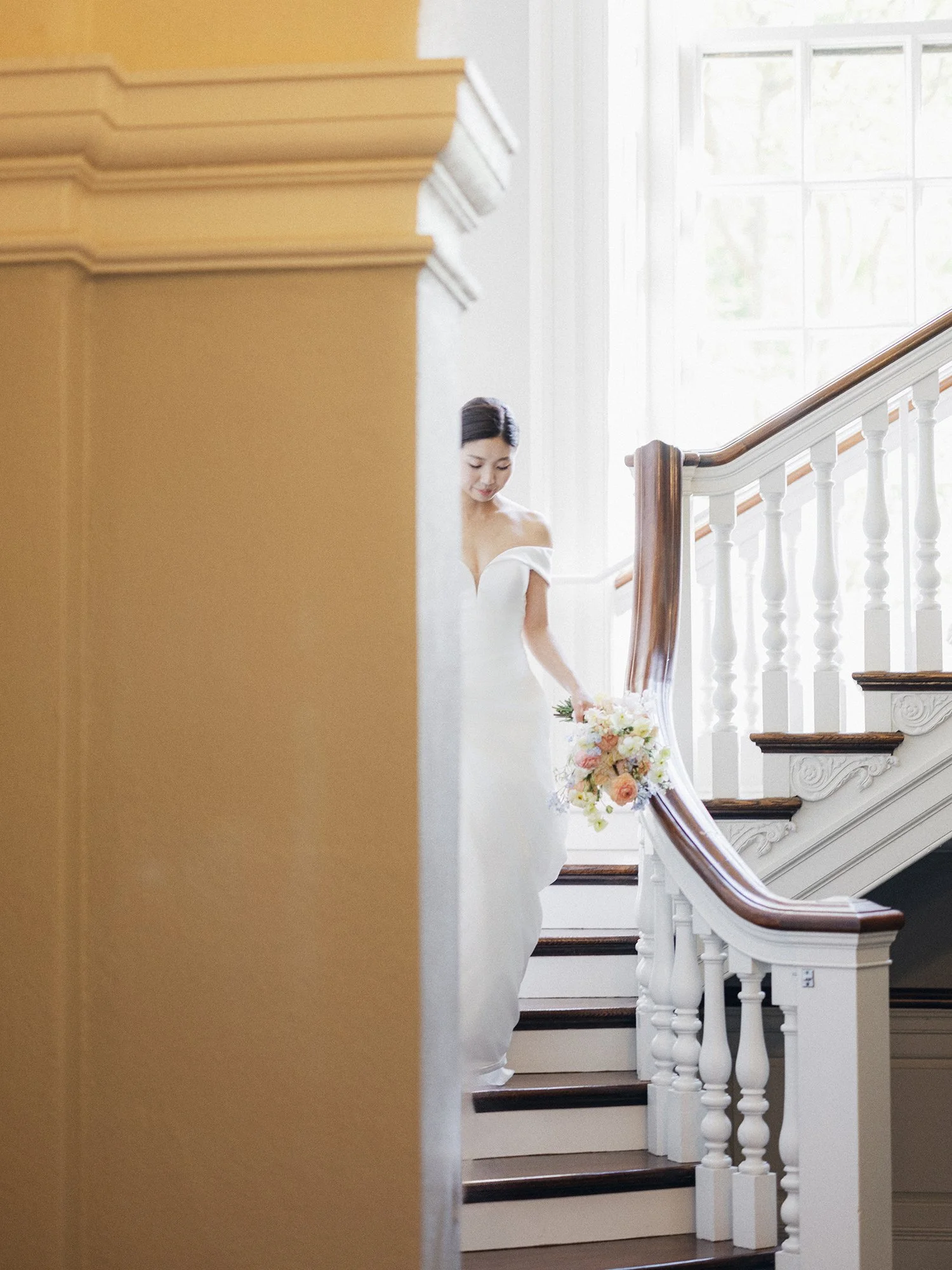Editorial wedding portrait using architectural lines and natural light