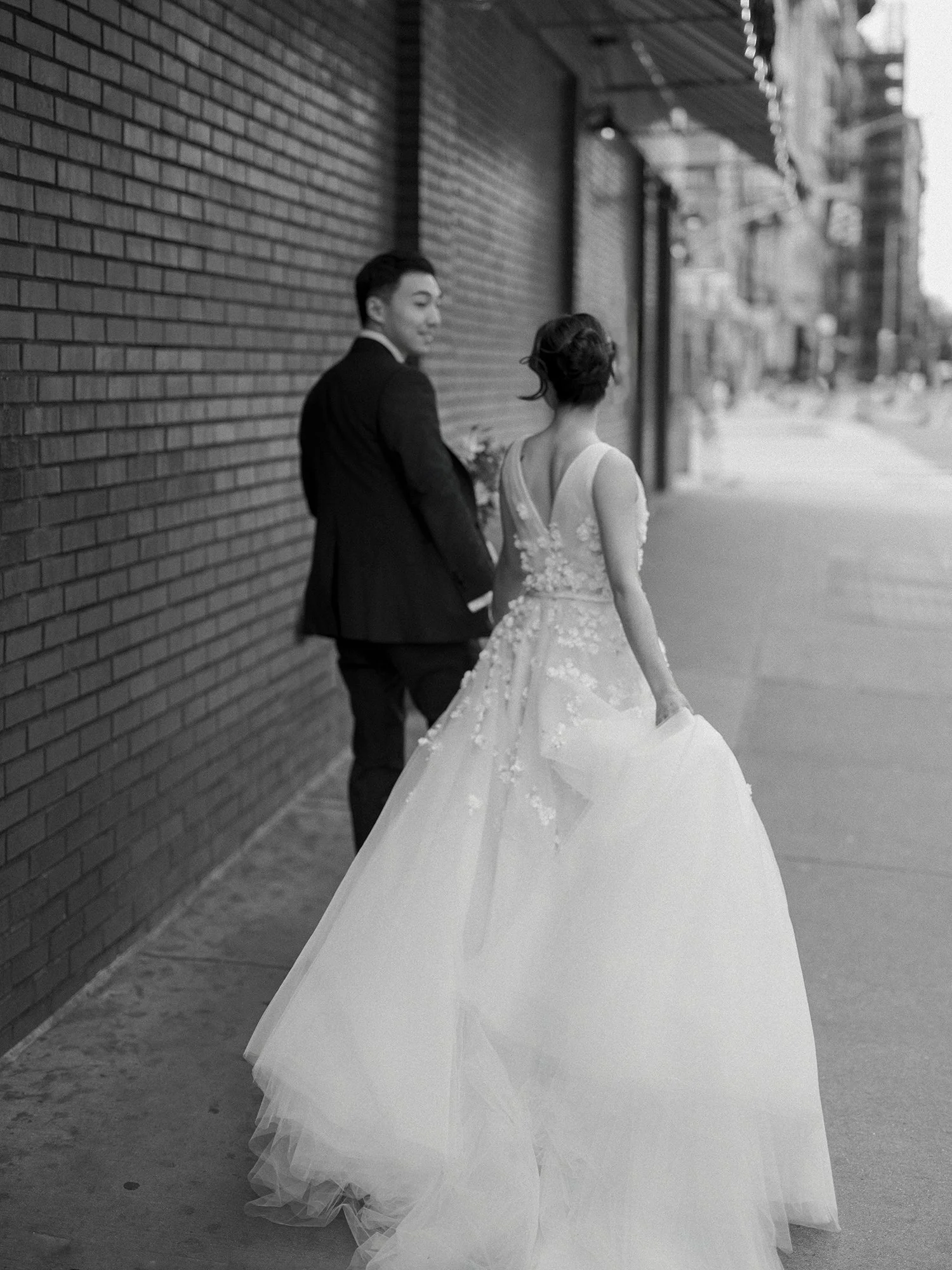 Bride and groom portrait outside a Manhattan hotel
