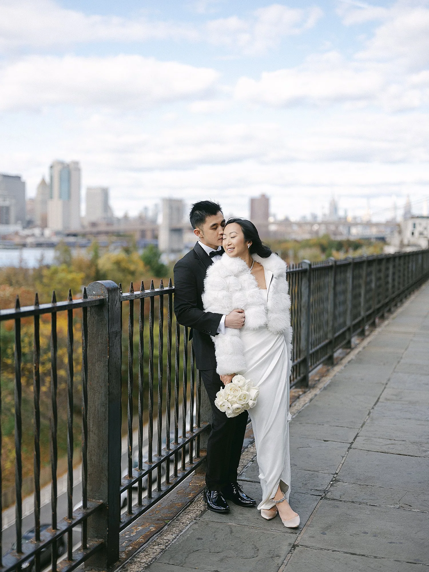 Bride and groom portrait overlooking New York City