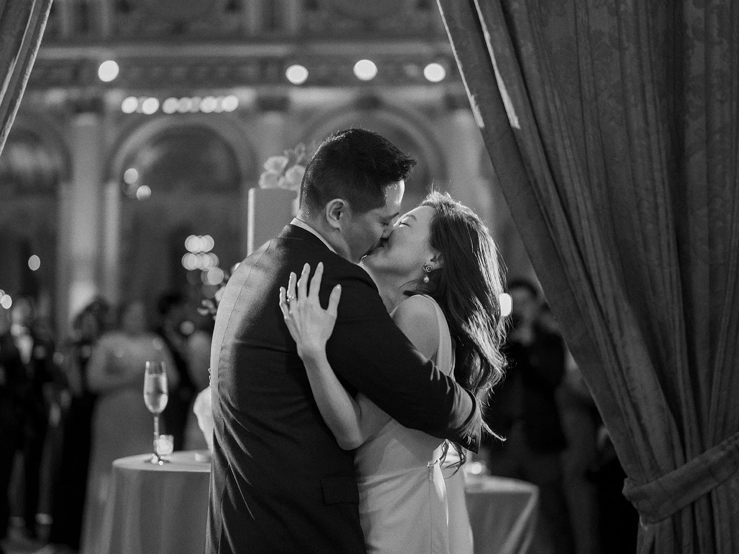 Bride and groom sharing a candid moment during their wedding reception