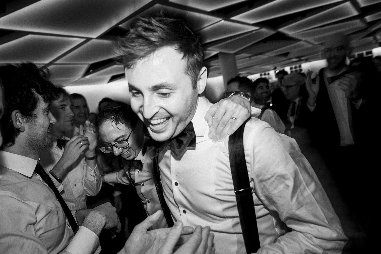 Wedding guests celebrating on the dance floor