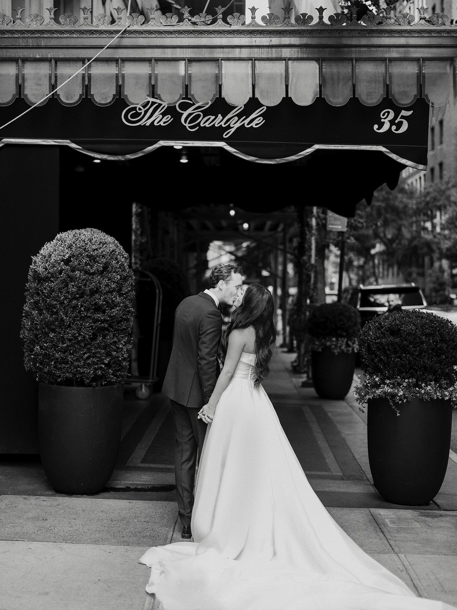 Bride and groom portrait outside a Manhattan hotel