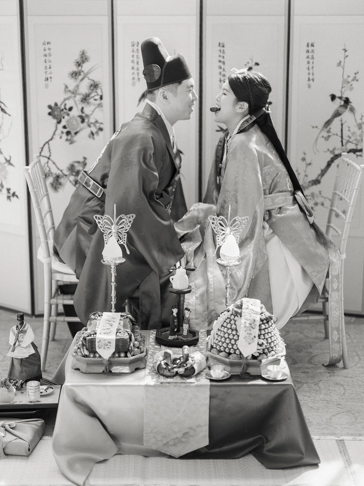 Bride and groom during a traditional Korean Paebaek wedding ceremony