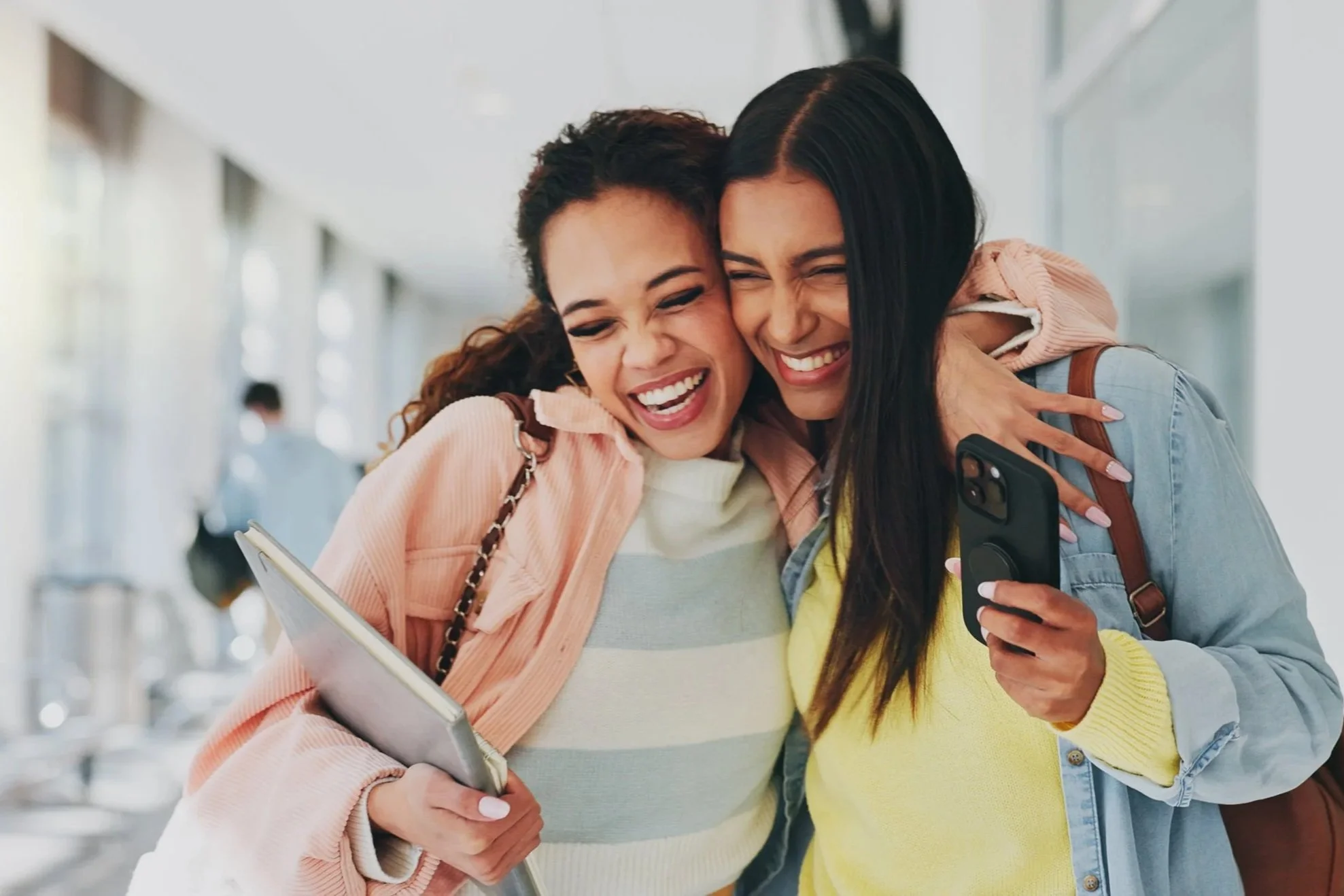 HIgh school students hugging