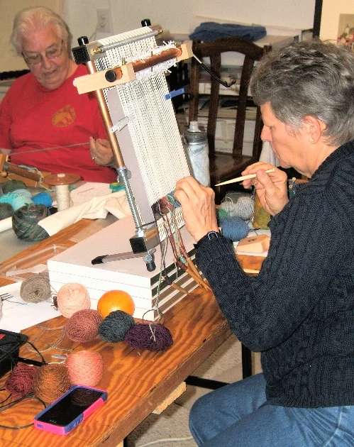 Maddie and Lavonne (n background) at their looms