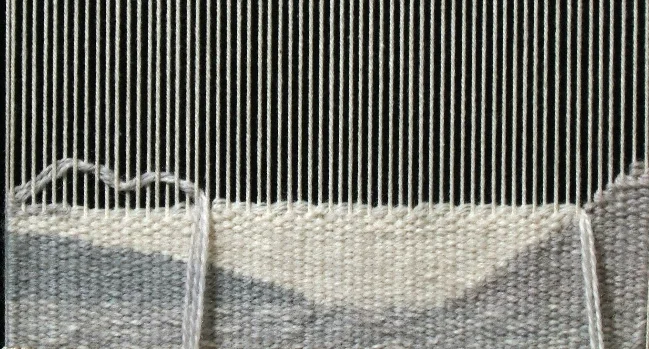 Weaving with Blend A, filling in the short and longer steps created with the solid white. This is another way to weave irregular hatching.