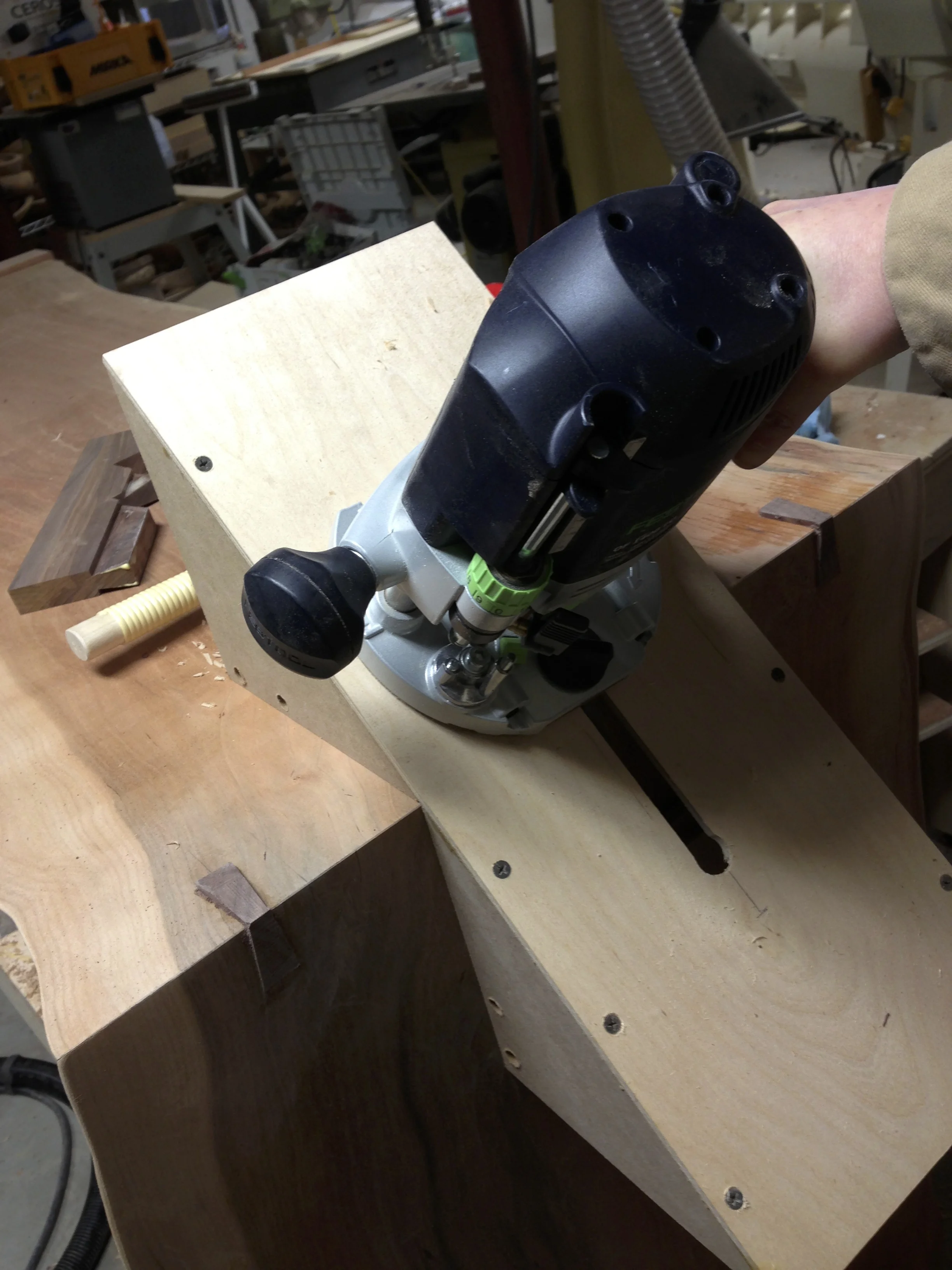 Routing dovetail keys into table miter with shop made jig
