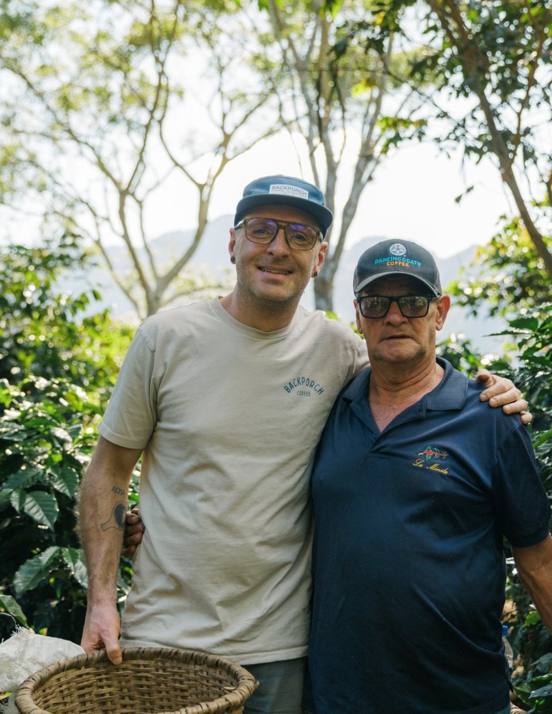 Dave Beach with his arm around a longtime La Minita farmer among the coffee trees