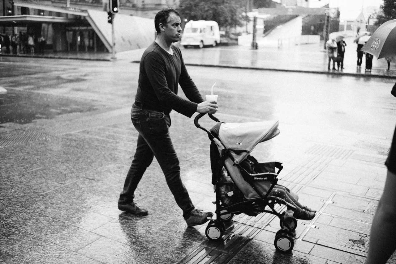  Dad racing his child through the rainy parts. 