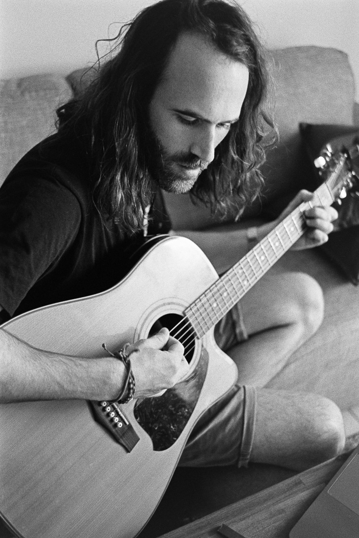  Tom playing guitar. 