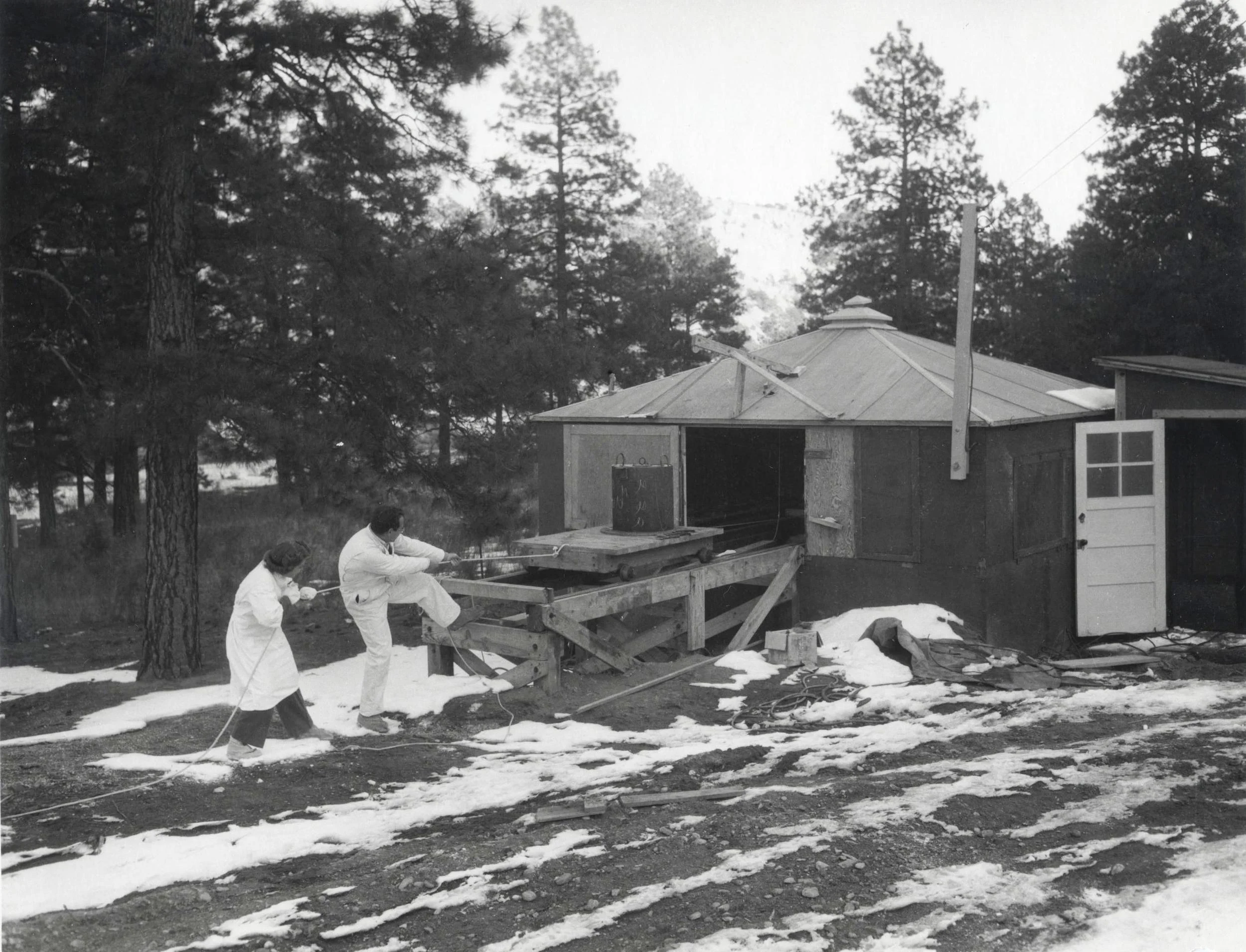 Scientists preparing a Lanthanum-140 sample for a shot at TA-10-1. Photo courtesy of LANL