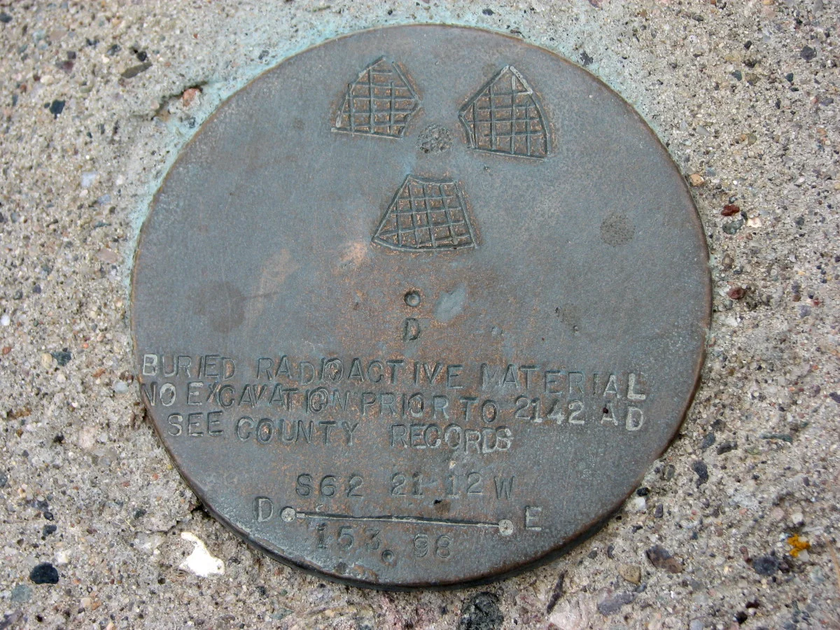 "BURIED RADIOACTIVE MATERIAL, NO EXCAVATION PRIOR TO 2142 AD"