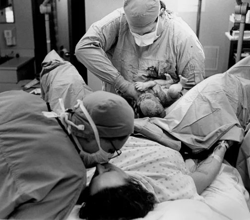 As part of a story on a obstetrician, we were allowed to photograph the delivery of a couple's first child.