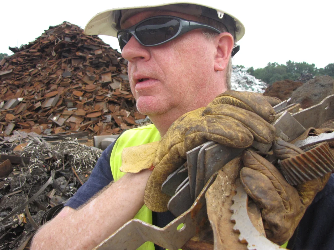 Greensboro, NC, sculptor Lawrence Feir gathers steel from a Raleigh scrap yard for use in his figurative work. He uses body casts as molds for the scrap, which he welds into the shape of the figure. Below, a collective of casts hangs from his studio…