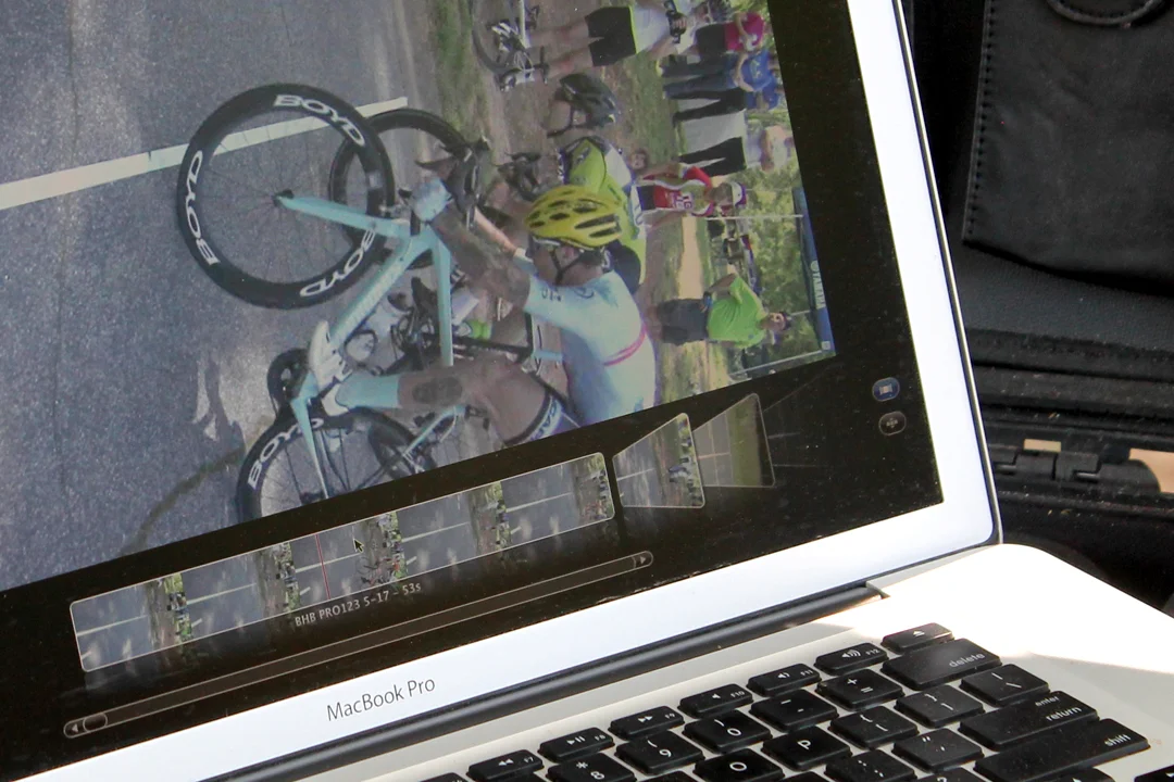 A bike throw by Brock Denis won his race over Charles Huegel. In the next photo, they congratulate each other.