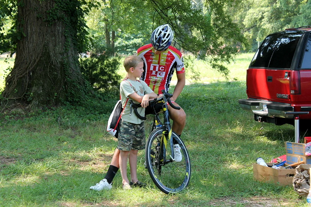 Terry Huss and his son, Ayden, hang out before Terry's Pro/1/2/3 race. Terry sometimes rides to the venue from his Clayton home, about 25 miles one way.