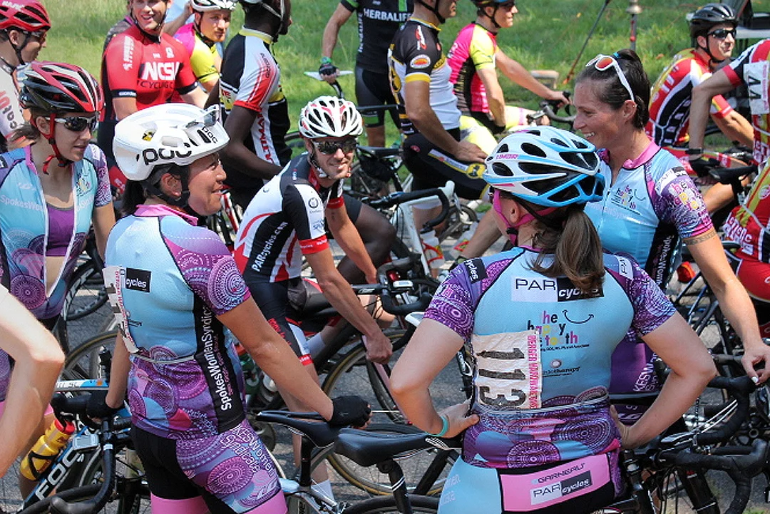 After the women's race, friends and teammates gather at the start line of the Pro/1/2/3 event. At center is Lucas Livermon, a mainstay at the series.