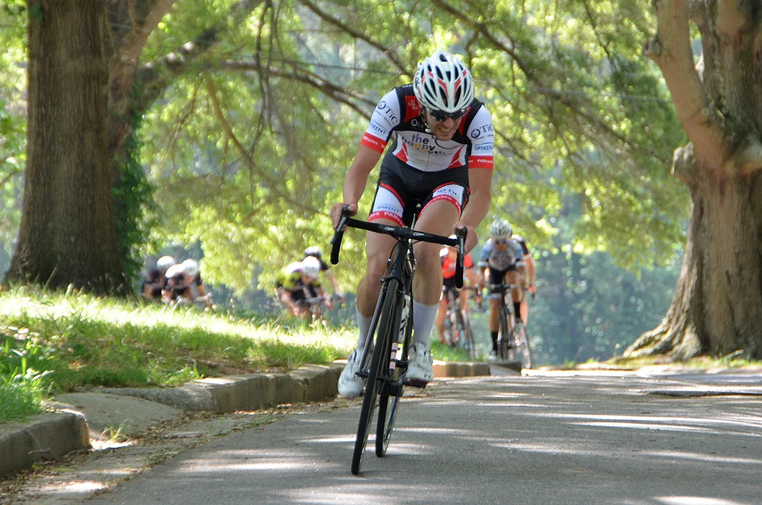 Lucas Livermon of Chapel Hill with The Happy Tooth team leads to field.