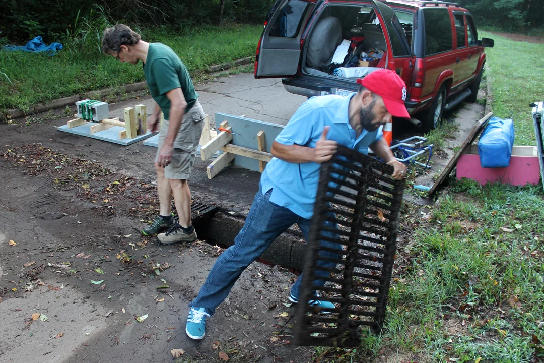 About 7 a.m. every race day, Berger Hardware Bikes' Todd Berger, right, and Mike Mueller clean up the course, which is mainly on unused streets on NC State's Spring Hill campus in Raleigh.