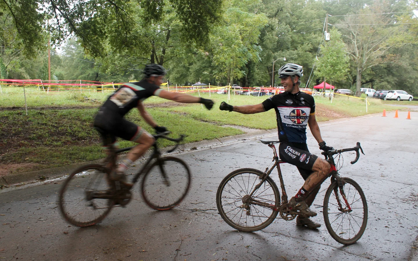 First and second places congratulate each other just after the finish line of a muddy race. A series of races, both road and cyclocross, takes place every year on the Spring Hill campus of North Carolina State University. An essay on the road series…