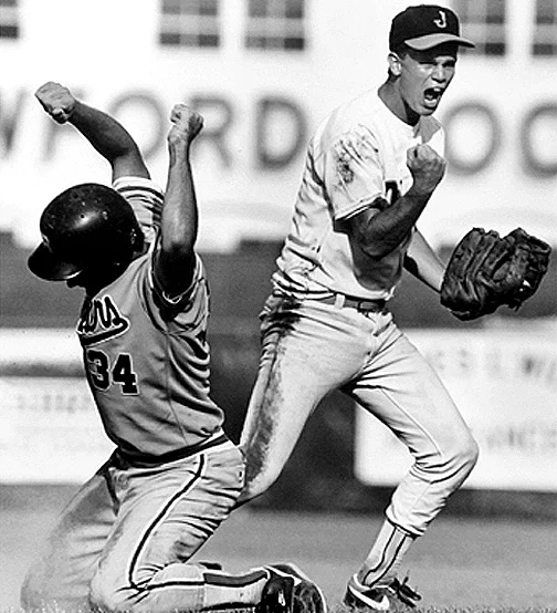 A member of the Jasper High School baseball team celebrates after getting an out at second base during the state playoffs.