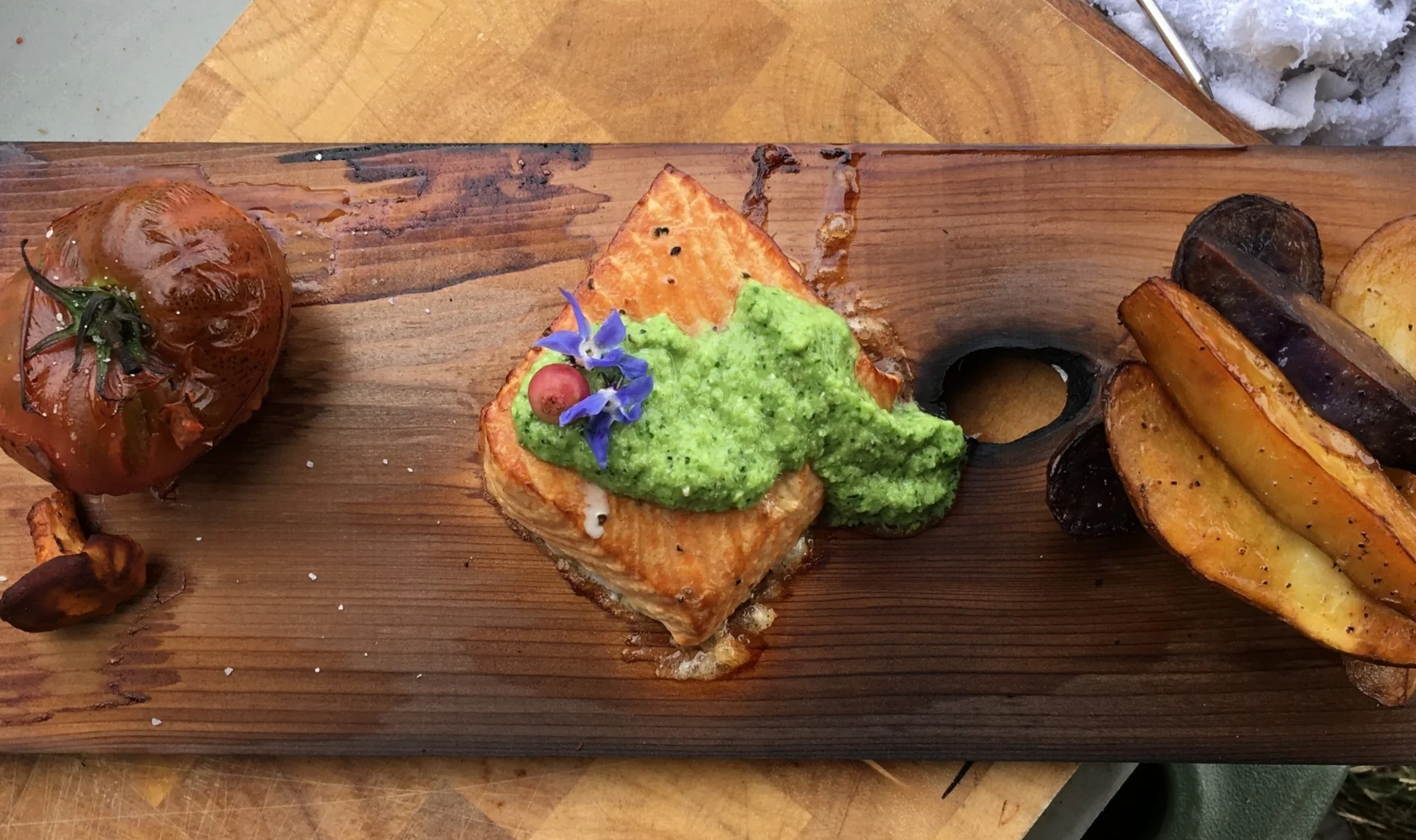 salmon and sides grilled on cedar plank