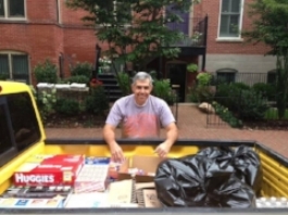 John Yori, President and Co-founder of USASOA loading up a truck to take to Walter Reed Military Hospital with the items collected for our wounded heroes.