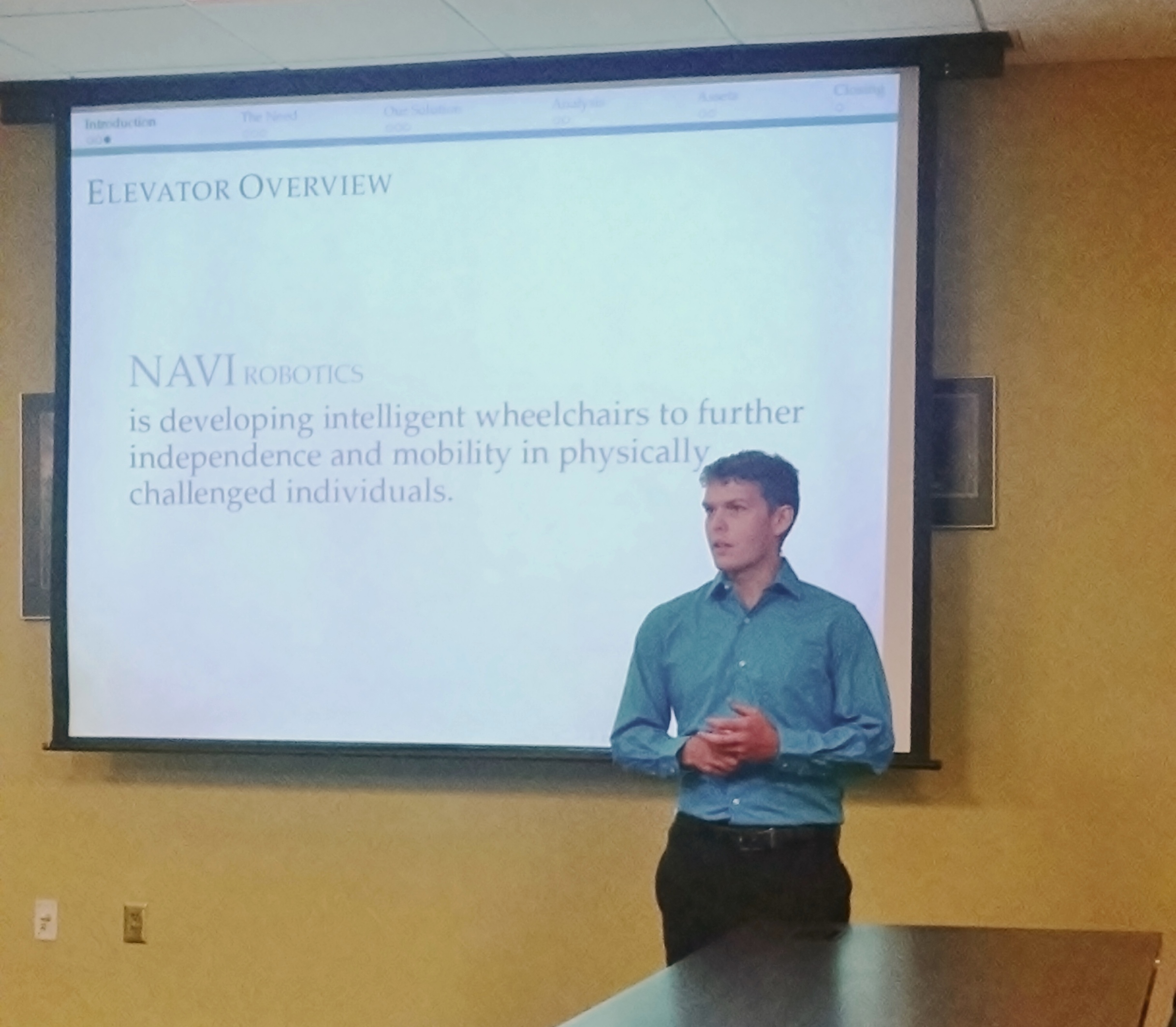 Engineering Accelerator student Dan Nix gives his team's elevator pitch to the MBA students from the University of South Dakota.