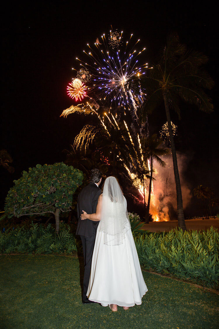 bride-and-groom-watching-fireworks-at-hilton-hawaiian-village.jpg
