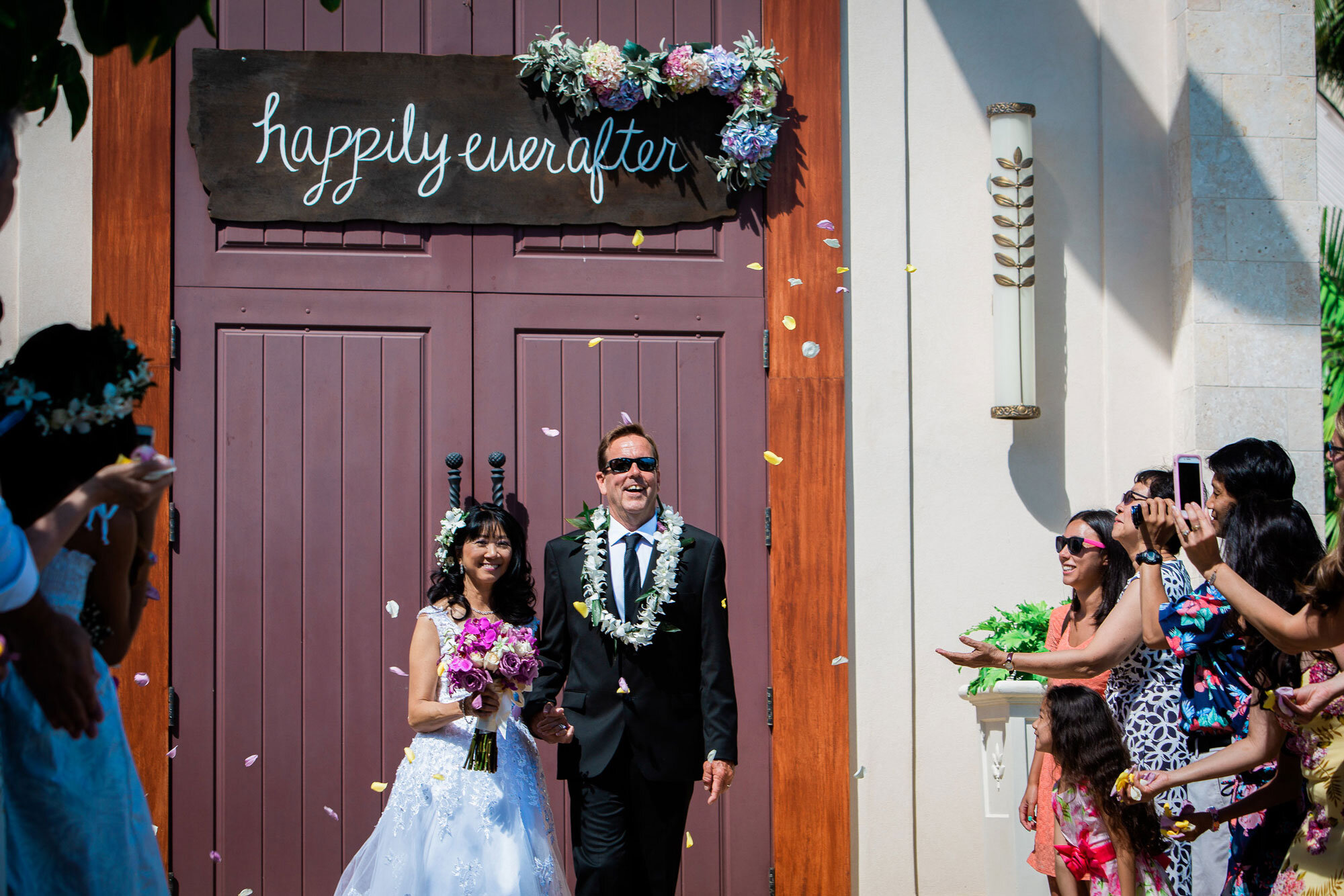 exiting-white-beach-chapel-with-a-flower-shower.jpg