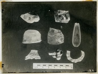Photograph of glass fragments, including the spoon, from the vicinity of the south end of the Summit.