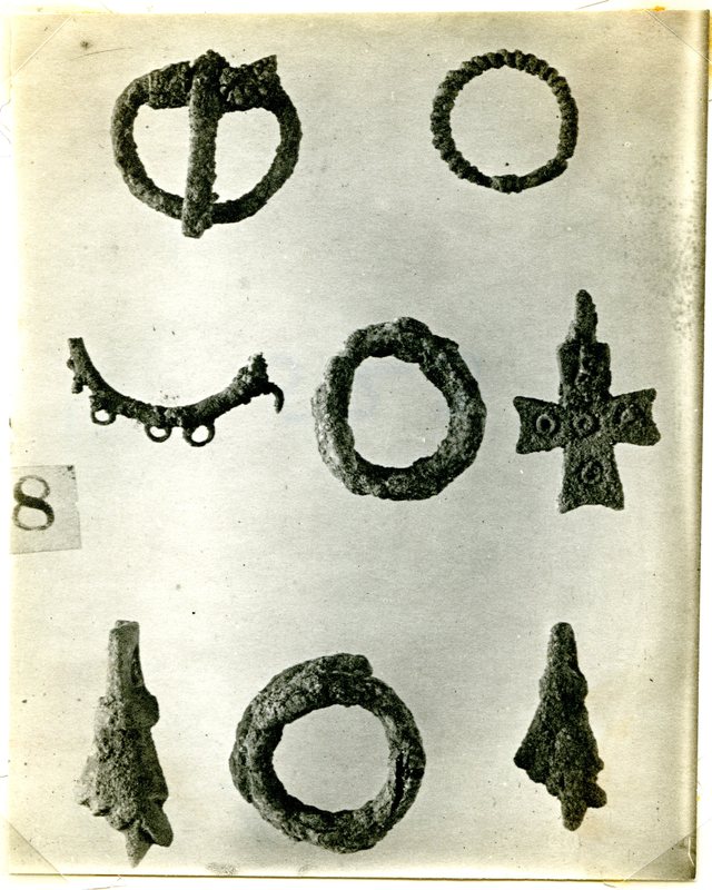 Small bronze objects from the Northern Cemetery, including the fist amulet.