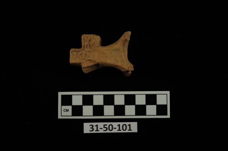 Cross-shaped lamp handle found in monastery