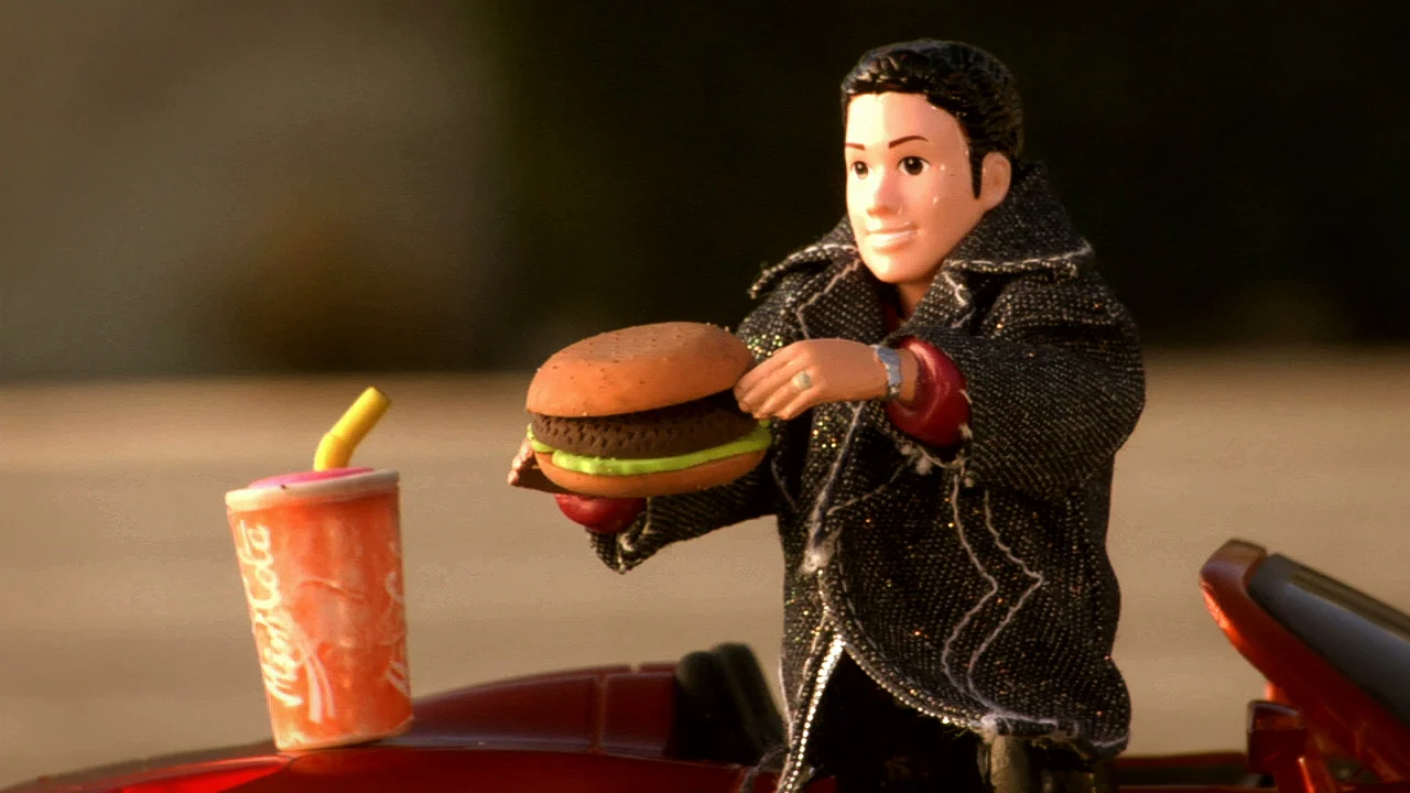 RJD2 - The Glow - screengrab - eating a burger.jpeg