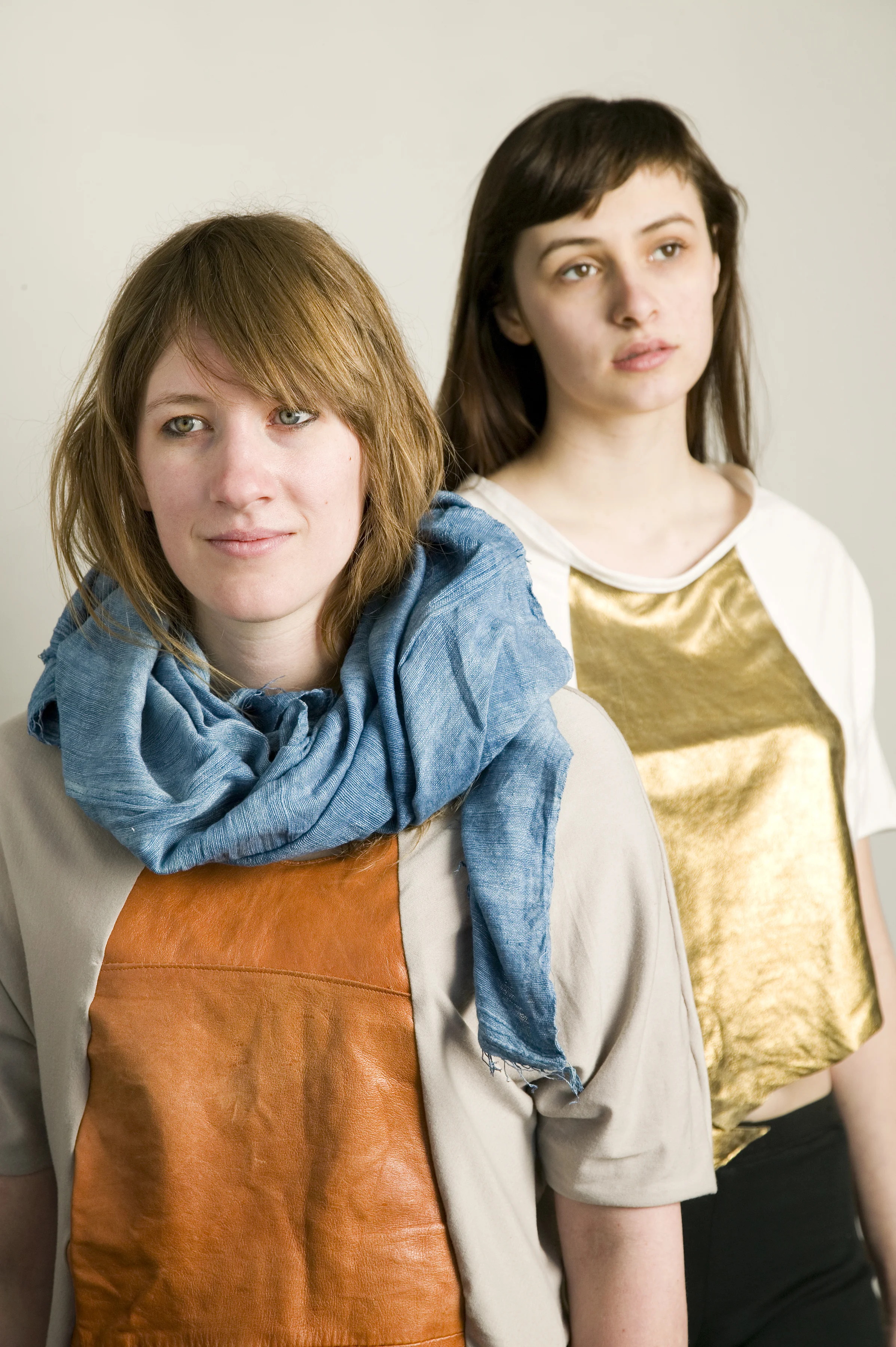 Emily is wearing Indigo Ethiopian Scarf, $38 and Leather Panel T in grey/brown, $48. Peaches is wearing Leather Panel T in white/gold, $48.