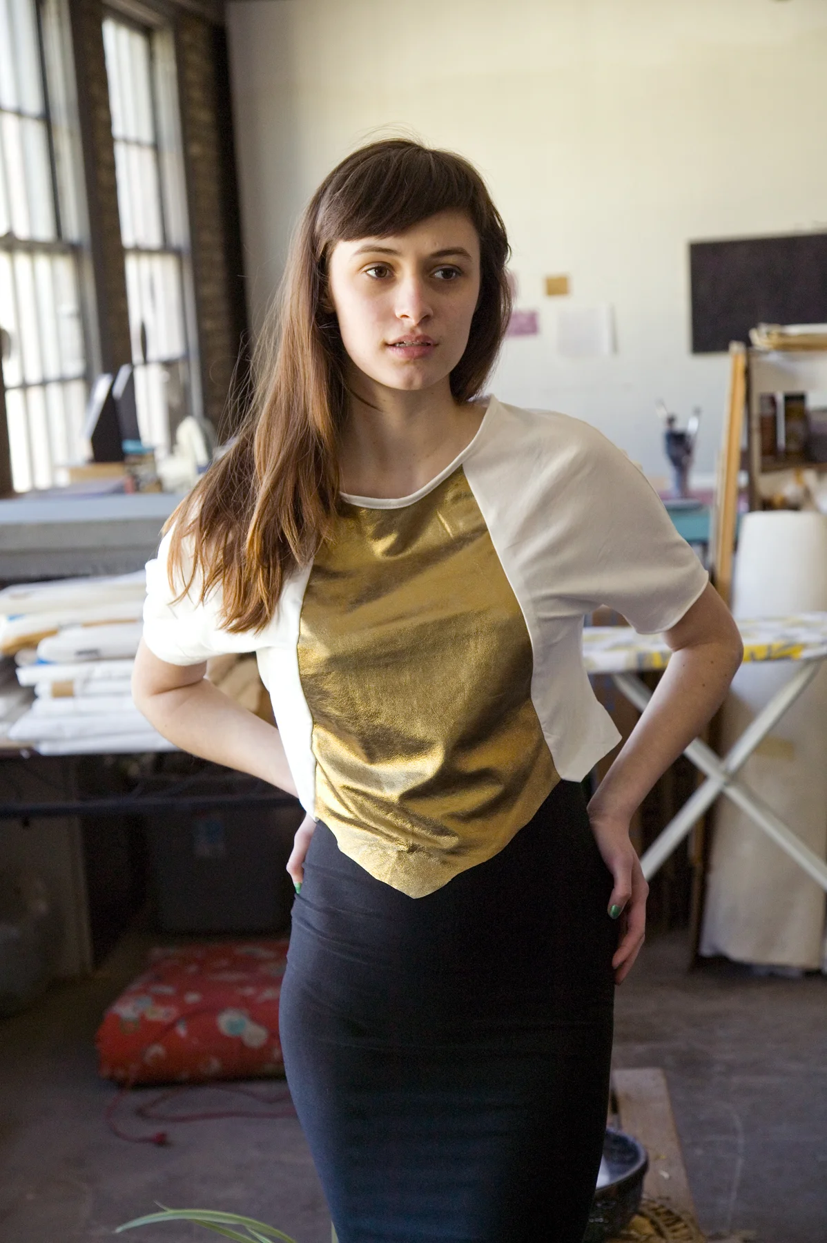 Peaches is wearing Leather Panel T in white/gold, $48 and Black Tube Skirt, $38