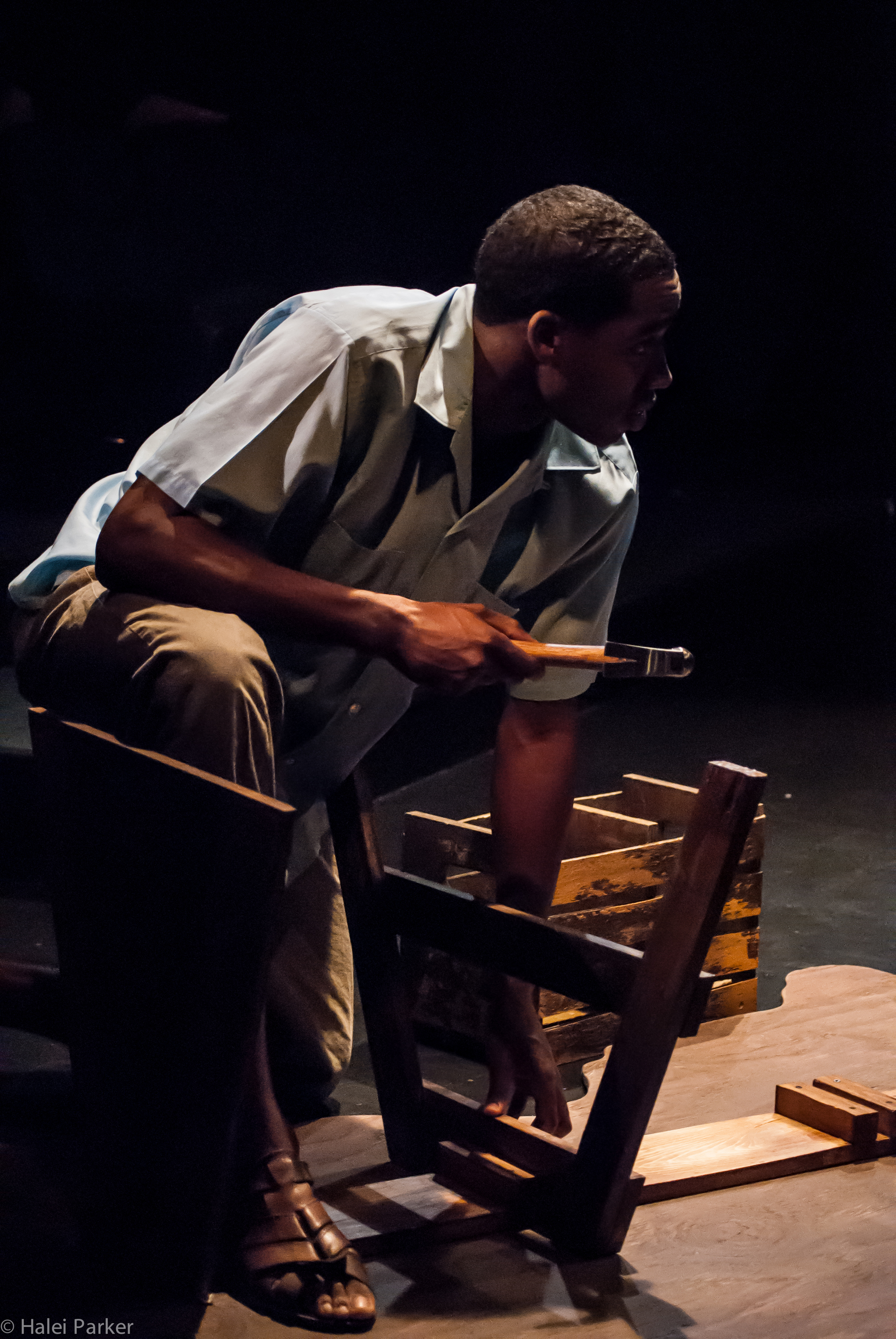Henri-Max (Maurice Williams) builds his boat to America as he argues with Edwin.