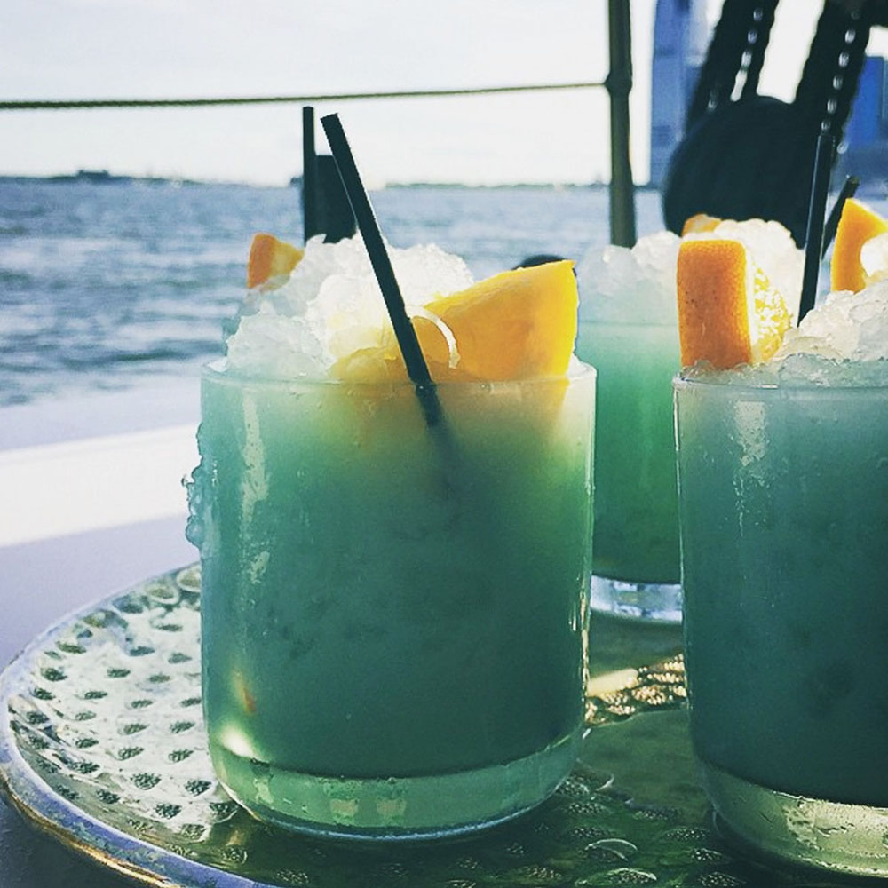 BLUE HAWAII ~ Vodka, Curaçao, Rum, Fresh Squeezed Orange