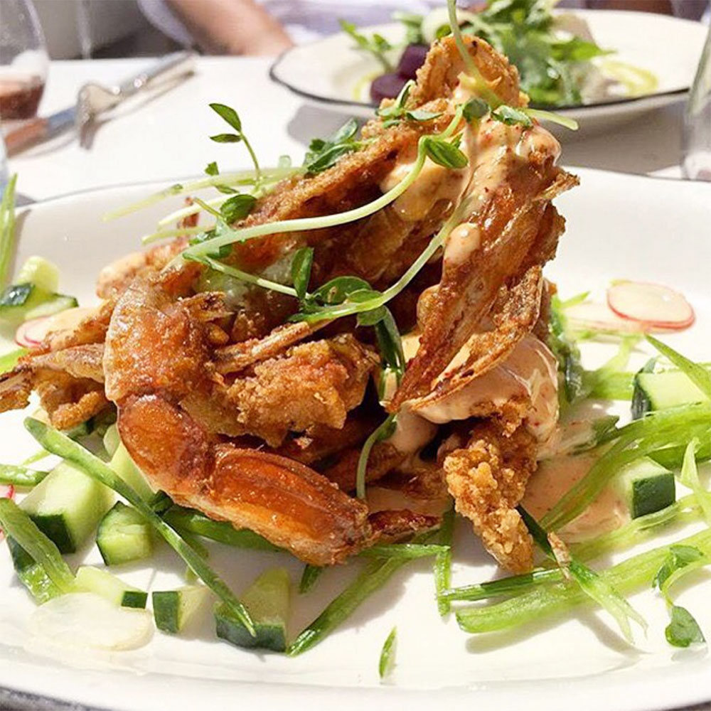 Fried soft shell crabs with lemon, herb, and espelette dresing, cucumber and snow peas