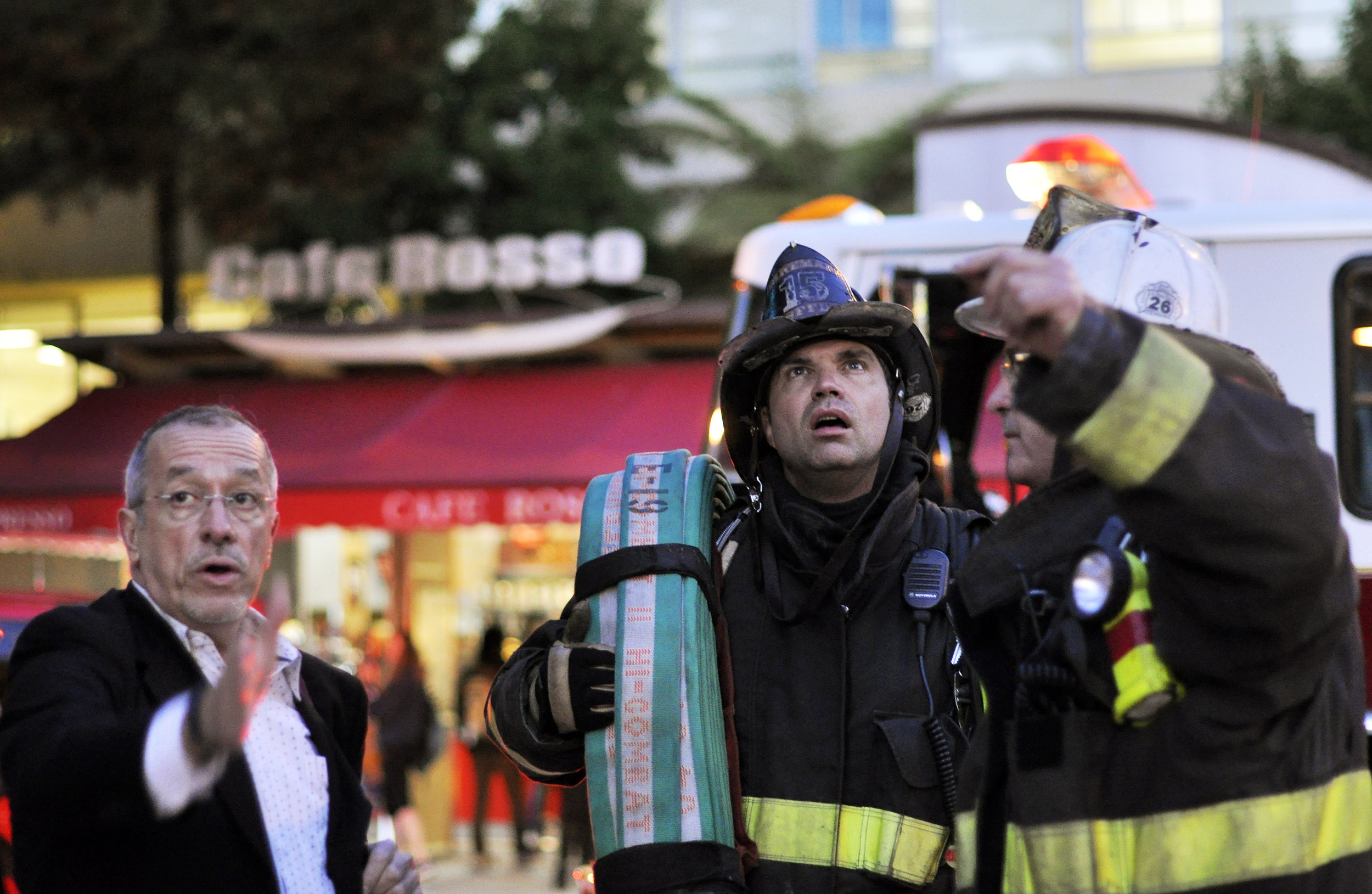  San Francisco Fire Department firefighters, right, look up to the second floor of the Humanities Building as they respond to a bathroom fire at SF State in San Francisco, Calif., on Tuesday, Sept. 18, 2012. 