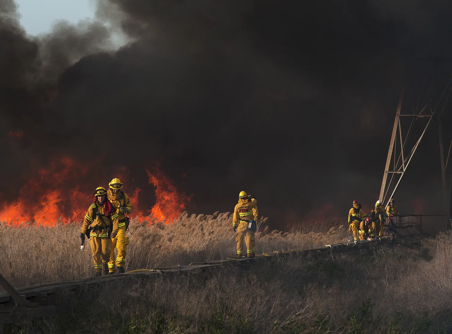  The Contra Costa County Fire Department responded to a three-alarm vegetation fire near a power plant on West 10th Street in Pittsburg, Calif., on Thursday, March 20, 2014. CCCFD Prevention Capt. Robert Marshall said the fire was reported at 3:20 p.
