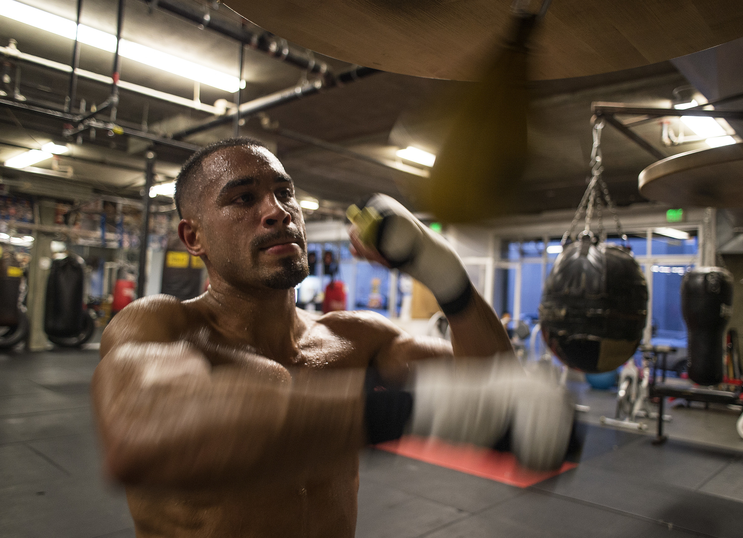  Jonathan Chicas hits the punching speed bag to end his training inside Third Street Gym in San Francisco, Calif., on Thursday, July 10, 2014. Chicas will be fighting Emmanuel Robles next Friday night. (Godofredo Vasquez/SFBay) 