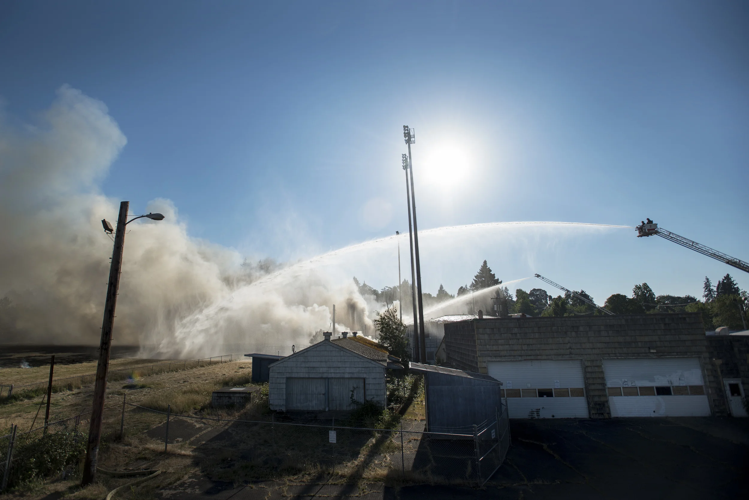  Eugene and Springfield fire departments work to extinguished a structural fire that destroyed Civic Stadium on Monday. 