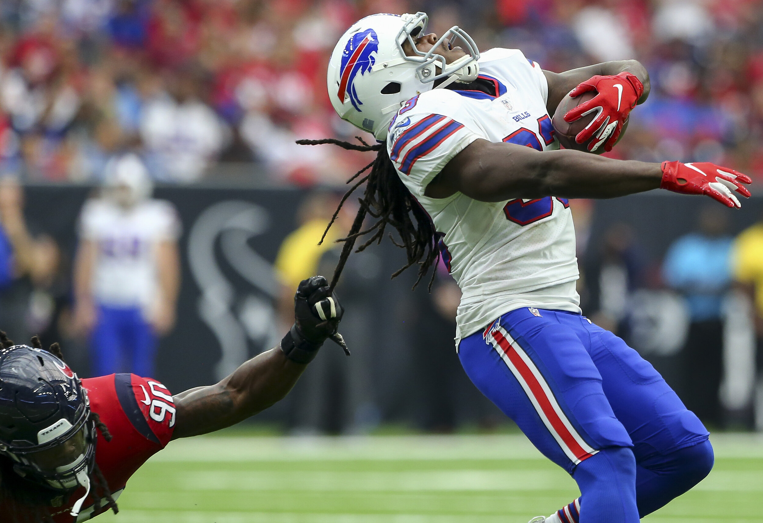  Houston Texans linebacker Jadeveon Clowney (90) tackles Buffalo Bills running back Chris Ivory (33) by grabbing his dreadlocks during the fourth quarter of an NFL game at NRG Stadium Sunday, Oct. 14, 2018, in Houston. The Texans won 20-13. 