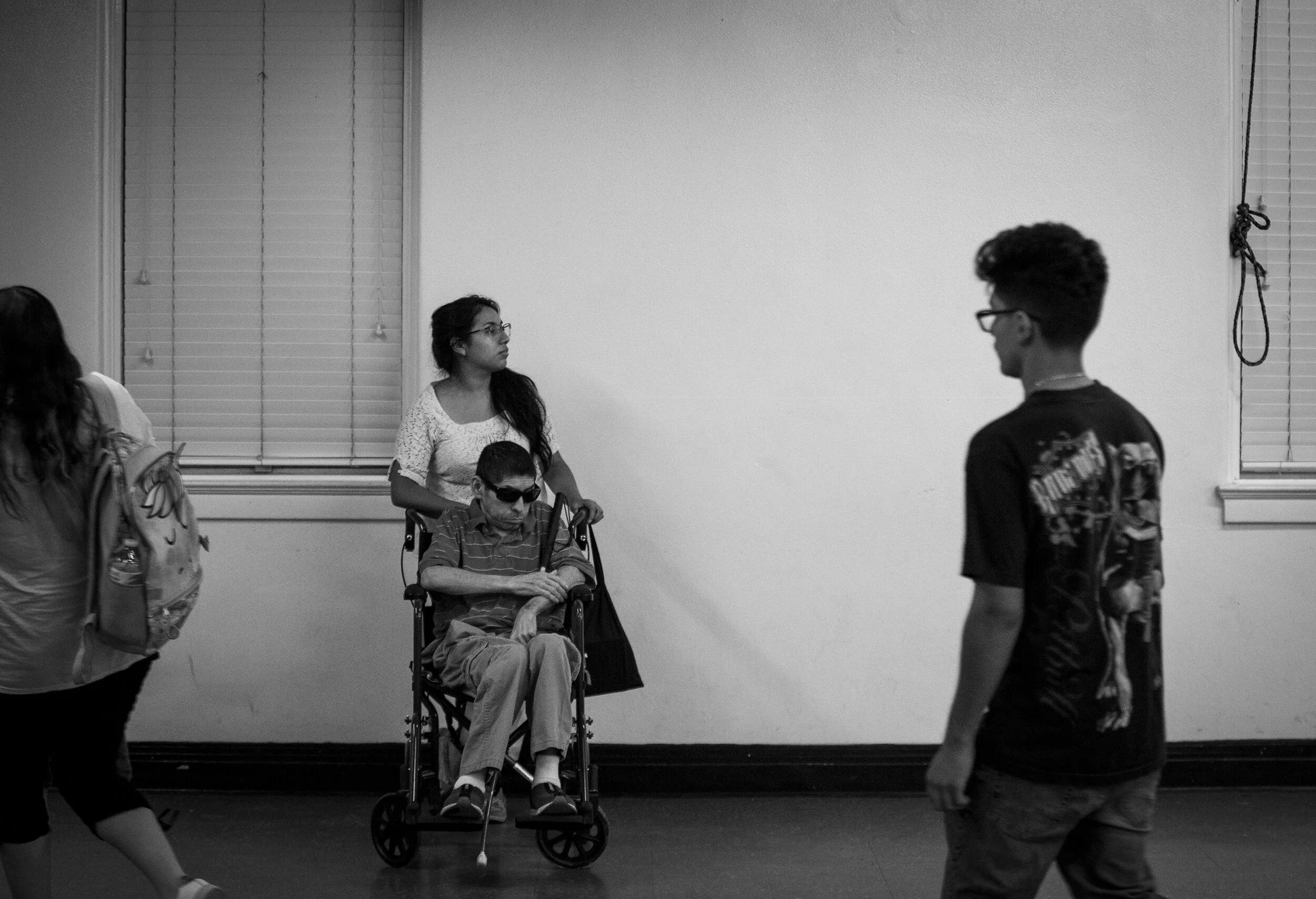  Lorena Argueta and her father, Guillermo, wait for prayer time to begin at a church in southeast Houston. Lorena, 26, is her father’s caregiver and spends every Friday night at church, a place where Guillermo gets to interact with others. 