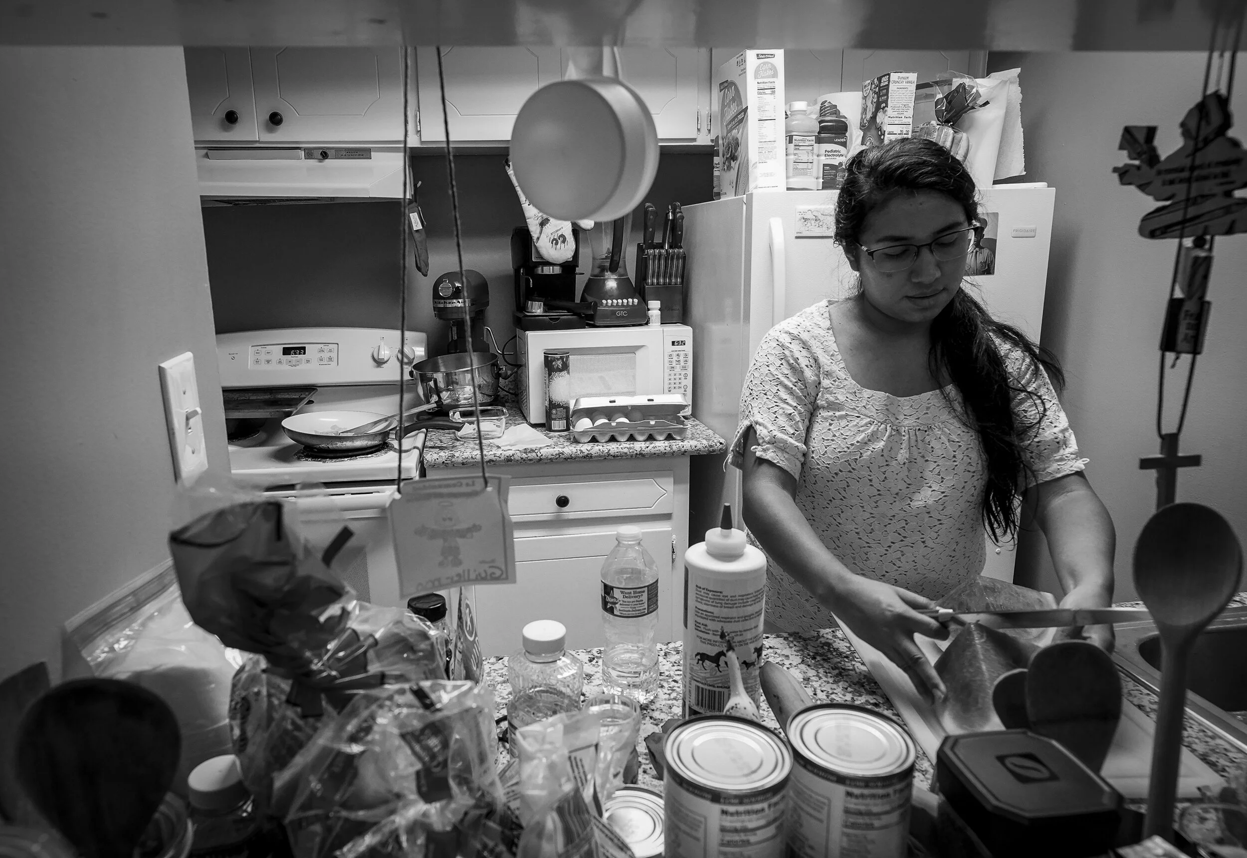 Lorena makes breakfast for her father every morning. She is the primary care taker for her father, who is blind due to the cataracts caused by diabetes. 