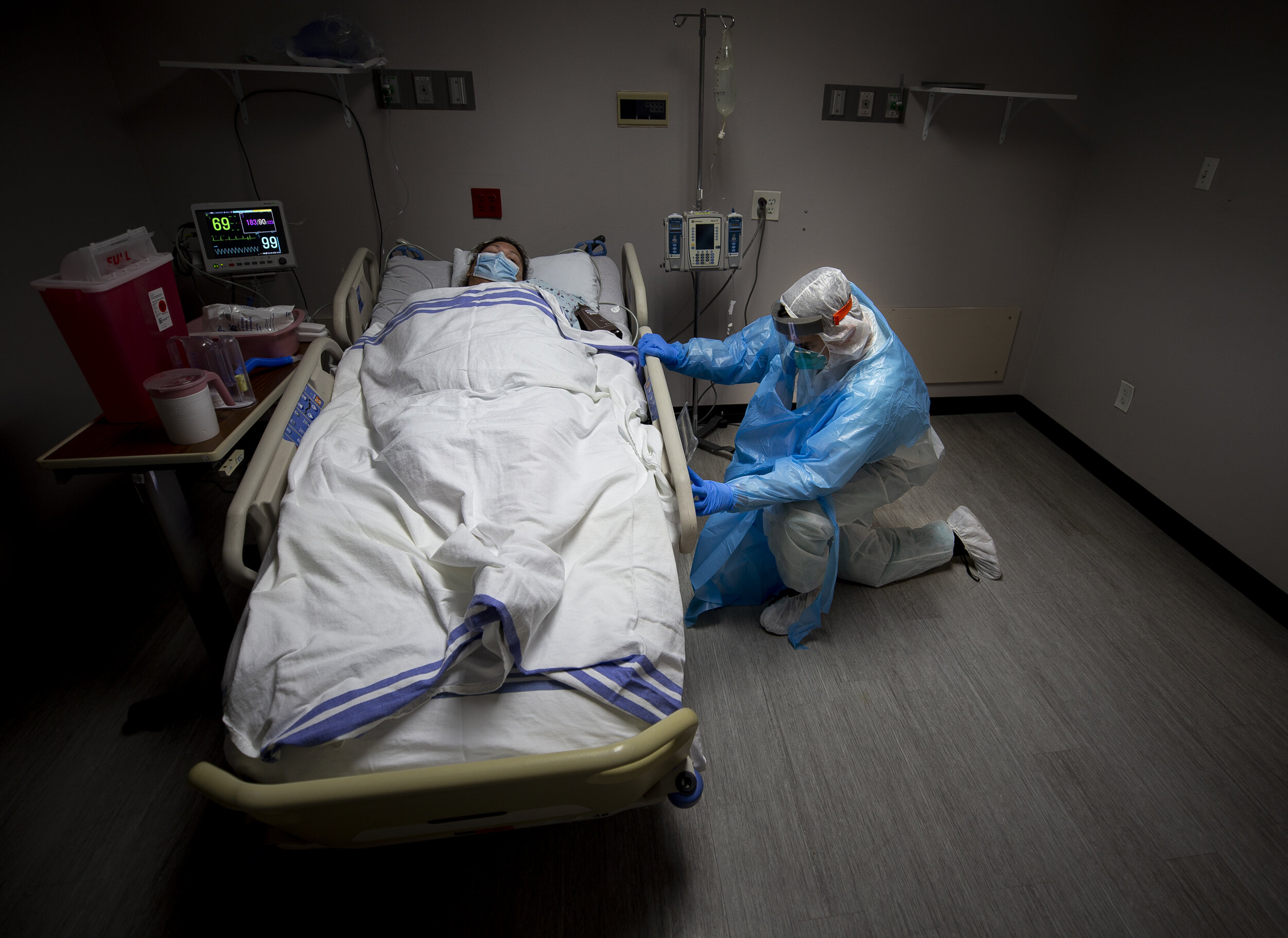  Medical intern Diego Montelongo, right, adjusts Denisse Moreno's bed after she was transported to the COVID-19 intensive care unit from the emergency room at United Memorial Medical Center on Monday, June 29, 2020, in Houston. Montelongo was going o