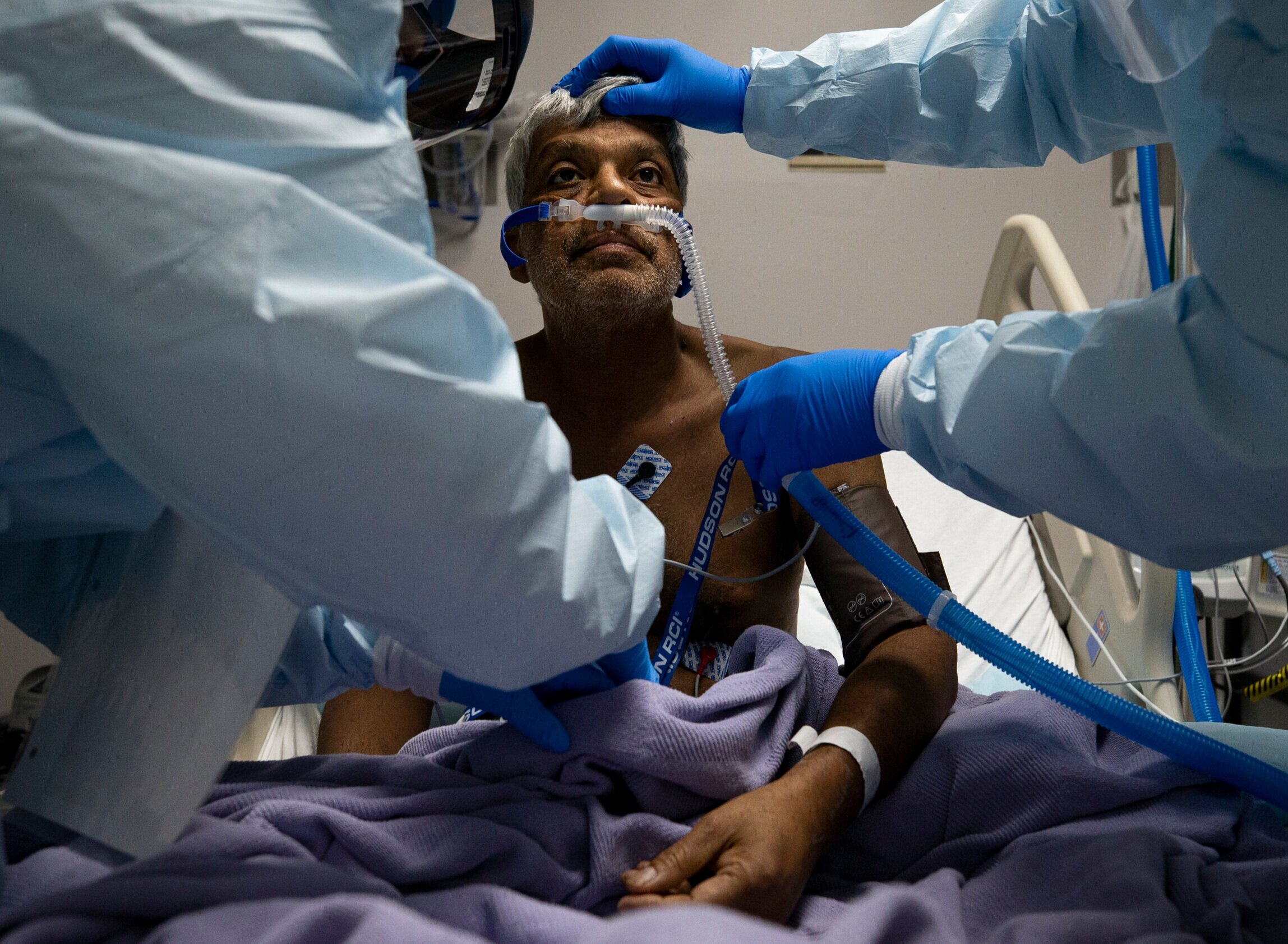  Medical staff check in on Mohammed Alam inside the United Memorial Medical Center COVID-19 intensive care unit on Sunday, June 28, 2020, in Houston.  