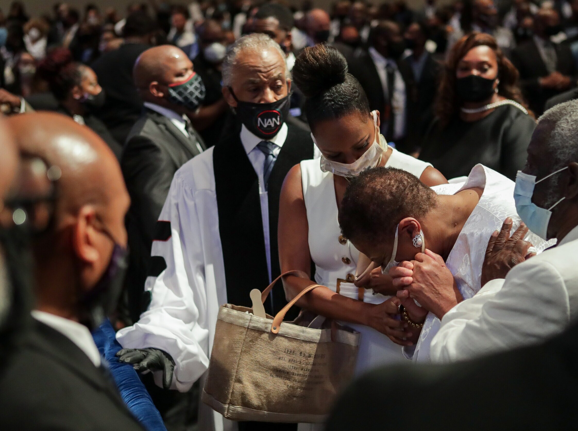  Mourners react as they look at the casket as the extended family processes into the funeral for George Floyd at The Fountain of Praise church on Tuesday, June 9, 2020, in Houston, Texas. Floyd died while in custody of the Minneapolis Police Departme